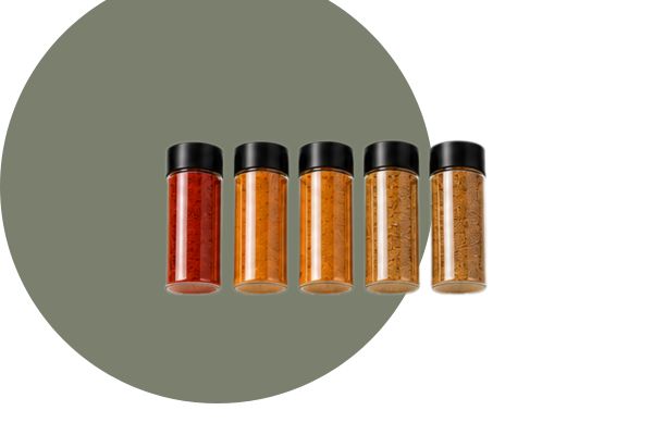 a row of colorful seasonings in bottles